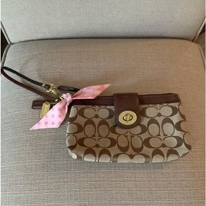 Coach original pattern wristlet / pink silk lining